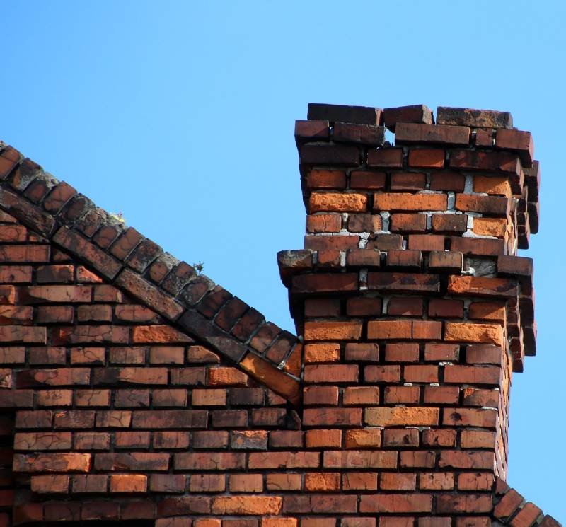 Signs Your Lauderhill Home Needs a Chimney Inspection Damaged chimney on an Lauderhill home showing cracks and missing mortar